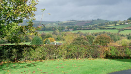 Private lawned garden with beautiful views and a children’s swing