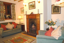 Cosy sitting room with a living flame coal effect gas fire